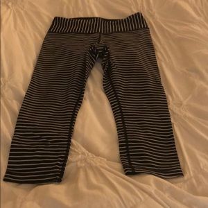 Lululemon striped wonder under Capri leggings.